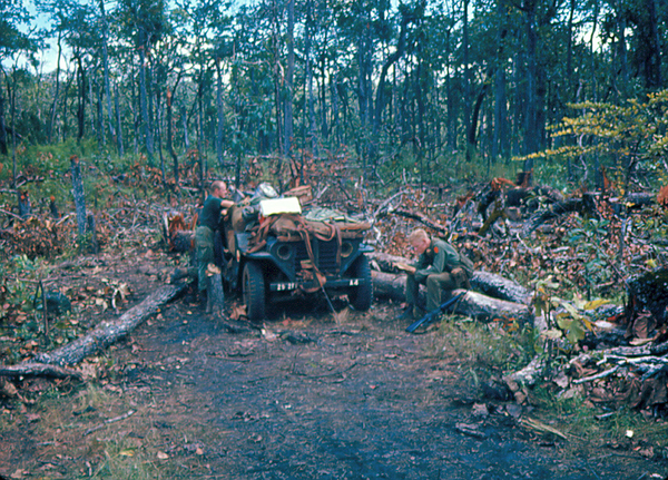 RSOP-ing
Load arrives at LZ 10B.  Now the fun begins to set everything up once again.  Sp4 John M. Waldman takes a rest on a downed tree at right.
