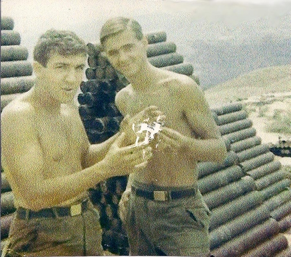 That Big!
Probably discussing the size of rats in Nam.
PFC Gregory J. Malnar with fellow redleg Sp4 Craig W. Faurot while at LZ Mile High with "A" Battery.
Time frame is late 1967.

