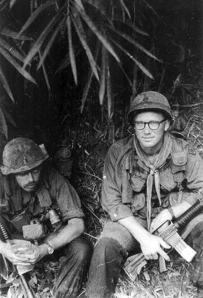 FO & His Boss
FO Lt Jim James (dec - 2020) and Cpt Chuck Chaplinski, "A" Company, 1/35th Inf Company commander find a shady spot in the jungle.
