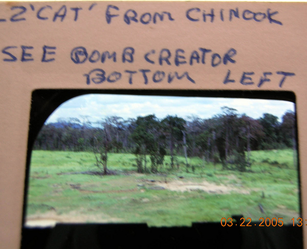 Bomb Craters
Taken at LZ Cat - you can see the bomb craters here.  Photo taken from the back door of a Chinook.
