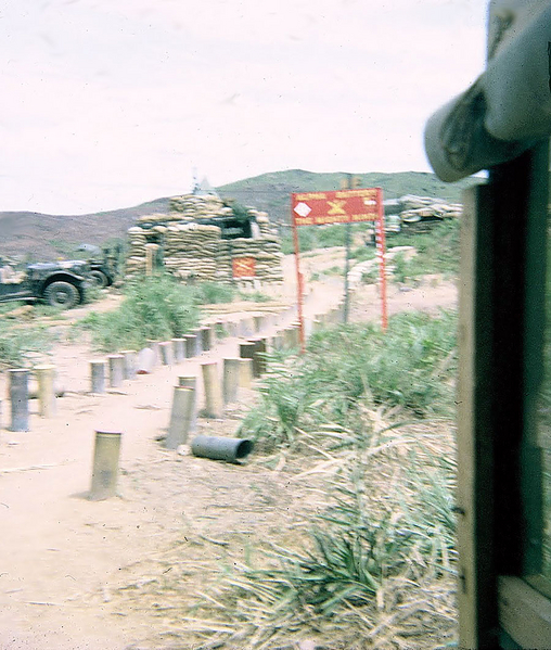 LZ OD
View from the enlisted personnel bunker to the sandbagged FDC CONEX.
