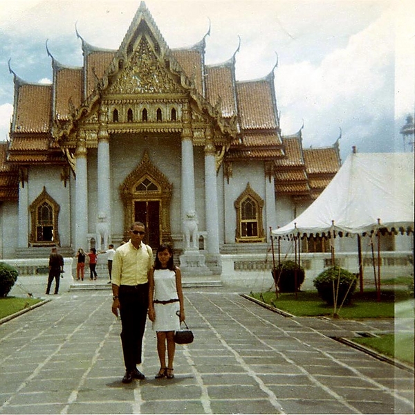 An offer I could refuse?
Here I am with my girlfriend (in T-strap heels, no less) at a Buddhist temple. Cute, huh? My driver (you could hire a 24/7 driver then- rather than get a taxi each time) for $15-$20 a week! And any time you left your hotel- day or night- he (or one of his close friends) was there waiting to drive you anywhere you wanted to go!  After I was out one night with my girlfriend, my driver said–rather surprised–in his broken English, "Ohhh! Sirrr... she berrdy plettty... but she not barhhh gurl !? I sink she rike you too much, huh? Maybe you make-a wife...no?"

