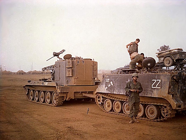 Charles Lovelady
Charles Lovelady at Montezuma standing next to the APC we affectionately called "Double-Deuce" on a tank retriever. It has just been hauled back from being either broken down or blown up. At one point, Double-Deuce was driven over a 500-LB. bomb that VCs buried. Driver, another friend, Derwyn Kaiser out of Baltimore, was (as I recall) saved by being blown out of the driver's hatch and had to undergo a long and painful hospital stay and operations. Oddly enough, we met not at Montezuma, but at a hospital down in Saigon as I recall when we were both patients.

