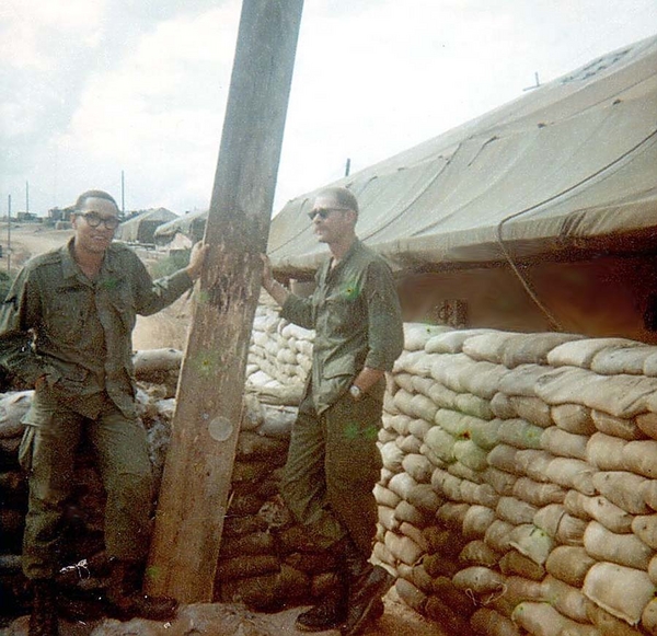 Sarge told us to straighten this pole
Another character from Duc Pho-LZ Montezuma.  Picture taken just after erecting tents and getting off the hard ground.  I'm on the left and can't remember the guy on the right.  He was from the Chicago area and insisted on being called "Mouse" or "Da Mouse".  Tore his real name off his fatigues.  He burned a lot of incense and got into Bhuddism.  Lotsa guys avoided him, but we got along.  Always wore sunglasses, even at night.
