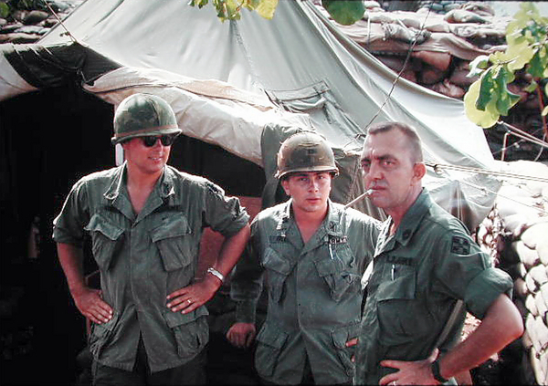 Staff Chat
UNK 2/9th Arty Battalion Staff officer (left) and Capt Earl W. Finley (center) talk with the Battalion Command Sergeant Major (UNK). 
