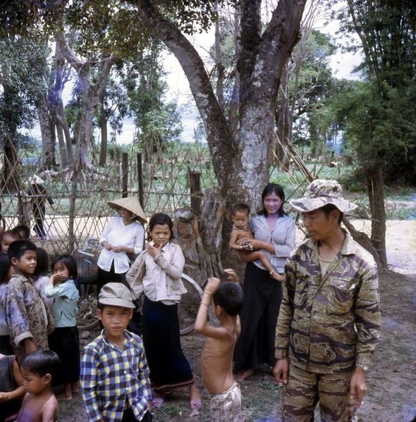 ARVN with kids
An ARVN soldier stands among young kids.
