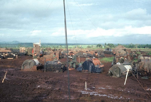 TOC RTO tents
Possibly LZ Penny.  You can see "B/2/9" painted on the bunker in the background.  The antenna guy wires have the white rag strips attached because you were always breaking your neck tripping over the wires.
