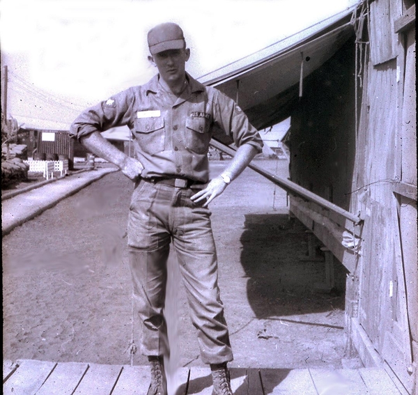 Well....Here I am!
Sp4 Robert "Bob" Wilson arrives at the 2/9th Base Camp around holiday time.  You'll notice that Danny Yates is a fellow artillery surveyor who served with me.
